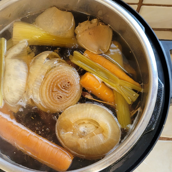 cooked bone broth ingredients inside of an instant pot